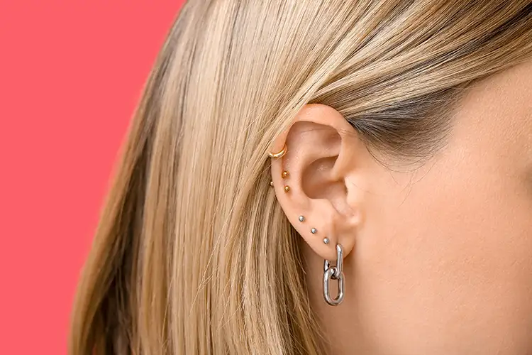 variety of earrings, hoops, studs, etc.